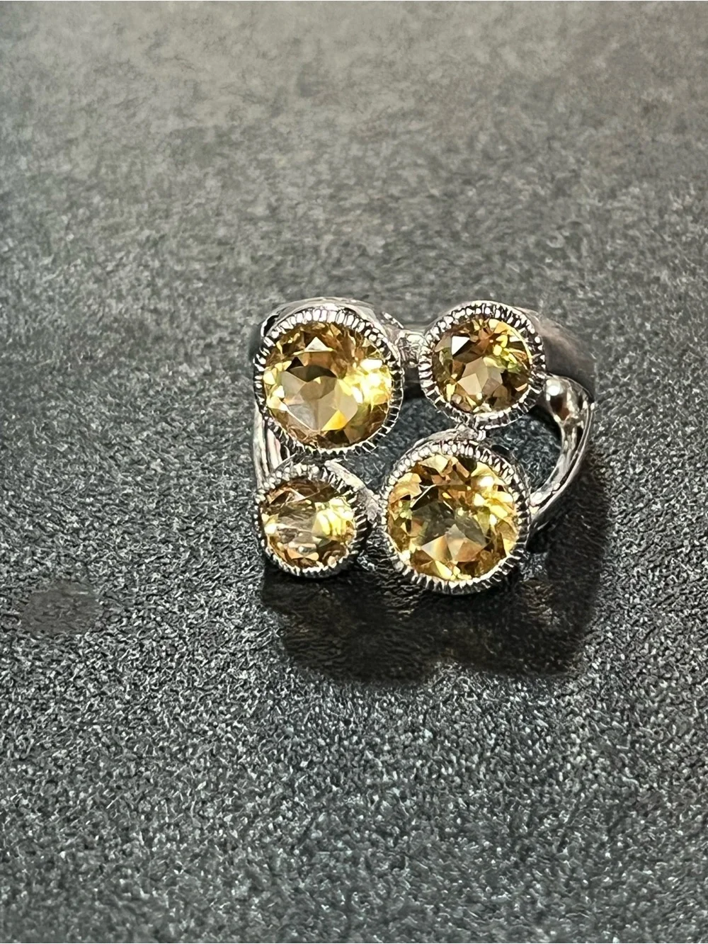 Sterling silver ring w/ 4 citrine gemstones. Sz 7. Pretty, unique design. 925
